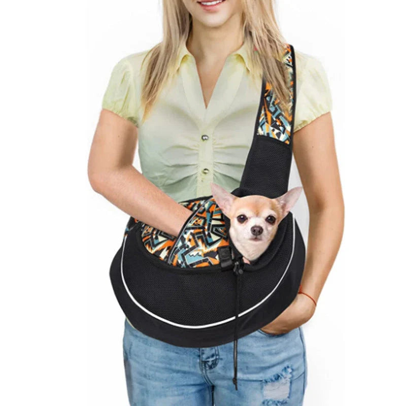 Stylish pet carrier bag with adjustable drawstring closure, breathable design, and zippered bottom for secure pet transport