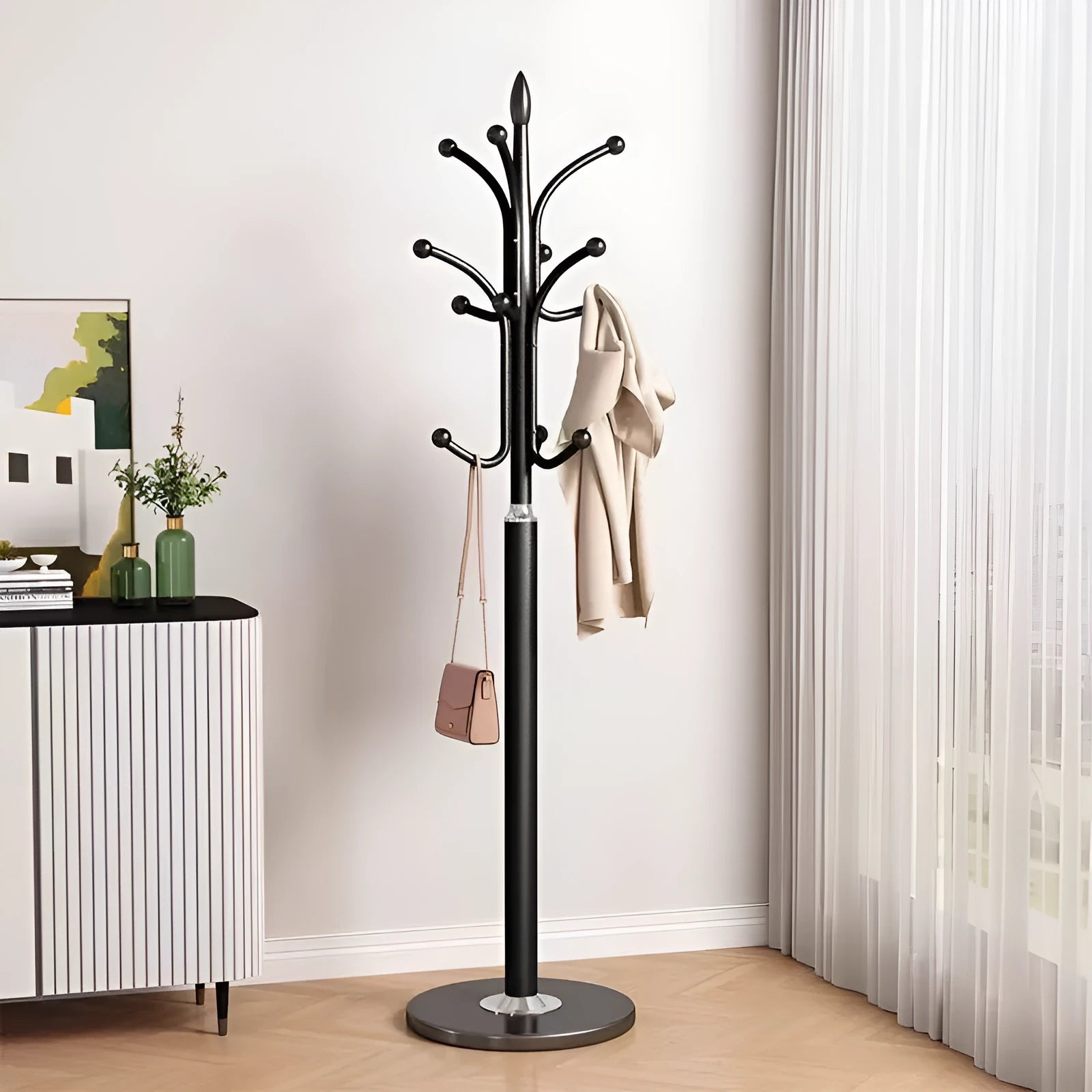 Floor-standing metal coat rack in black, vertical design for bedroom use, simple iron frame