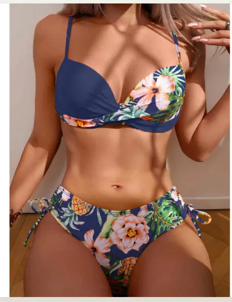 Green printed two-piece bikini with a push-up top and drawstring-tie briefs laid flat.