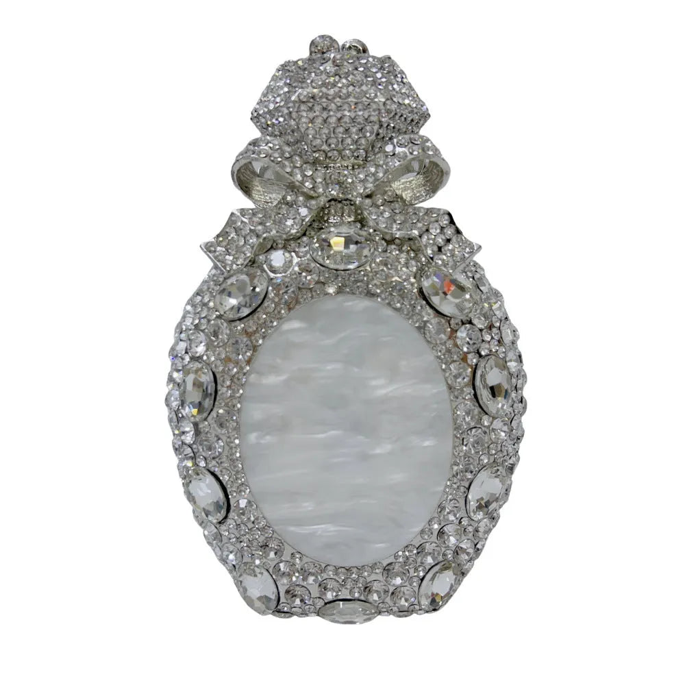 Golden women's hard shell clutch bag covered in sparkling diamonds for formal events.