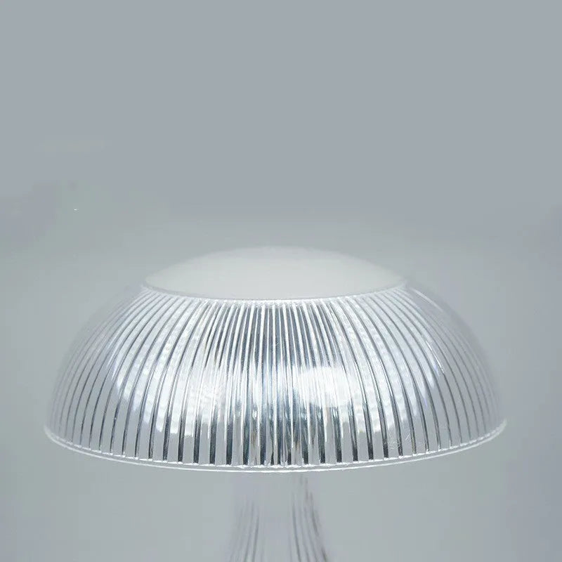 Small white USB rechargeable touch night lamp with three colour changing LED light.