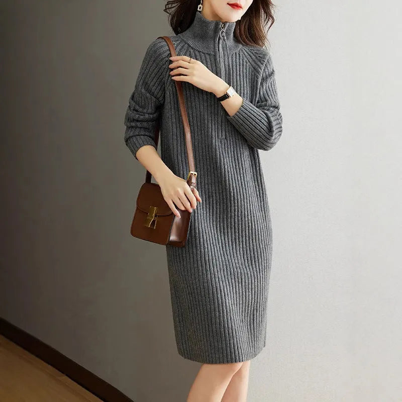 Beige half zip straight skirt with long sleeves and a stand collar, shown on a model.