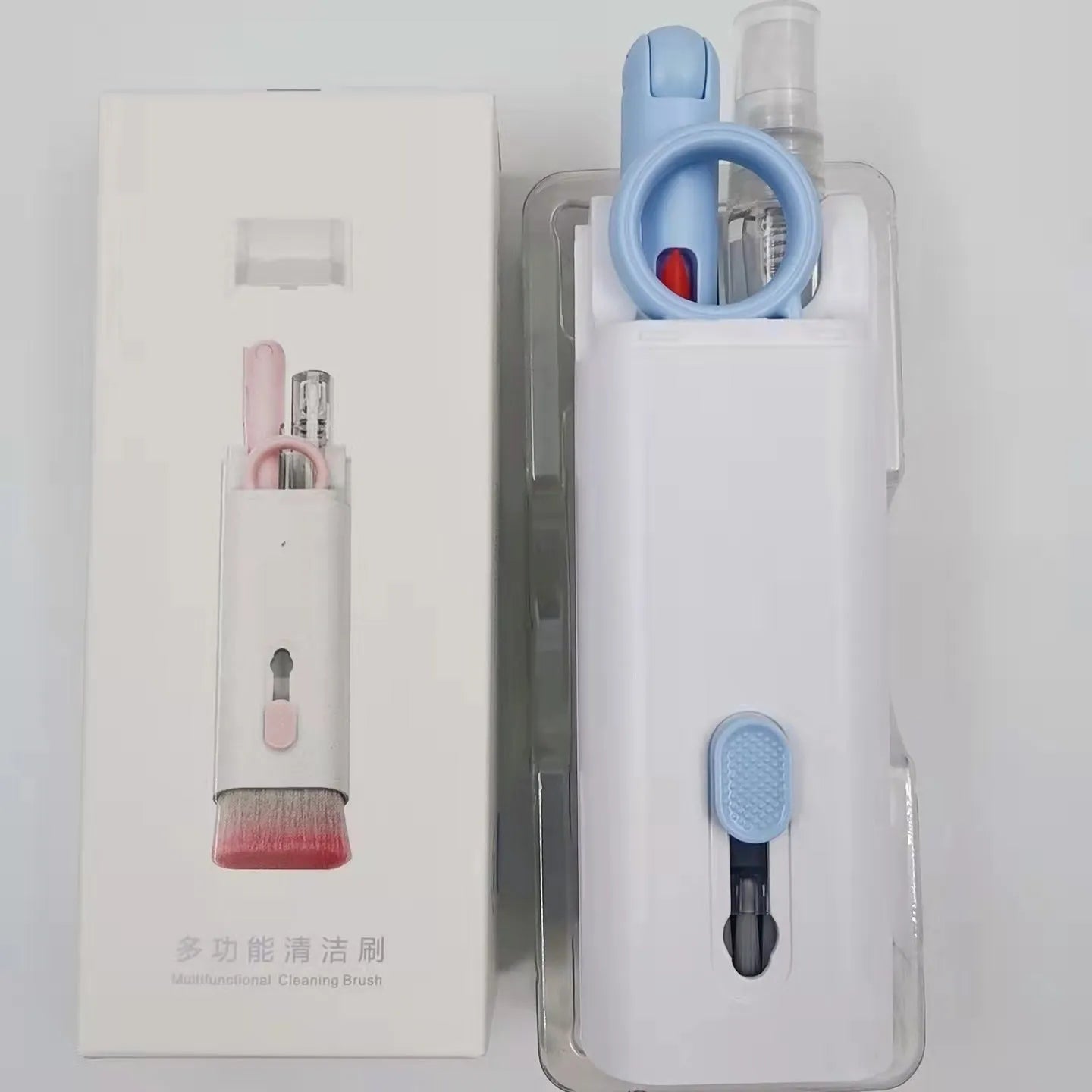 Multifunctional electronics cleaning kit with cleaning pen, brush, key puller, and spray bottle on a white background