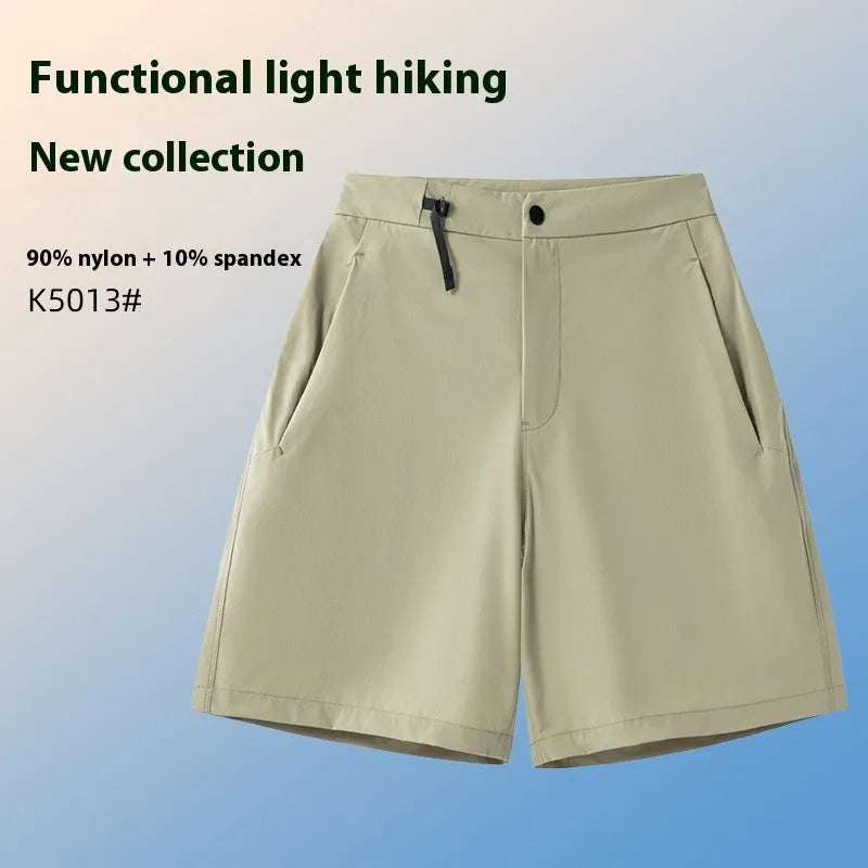 Man wearing khaki quick-dry sports shorts with four-way stretch on a running track.