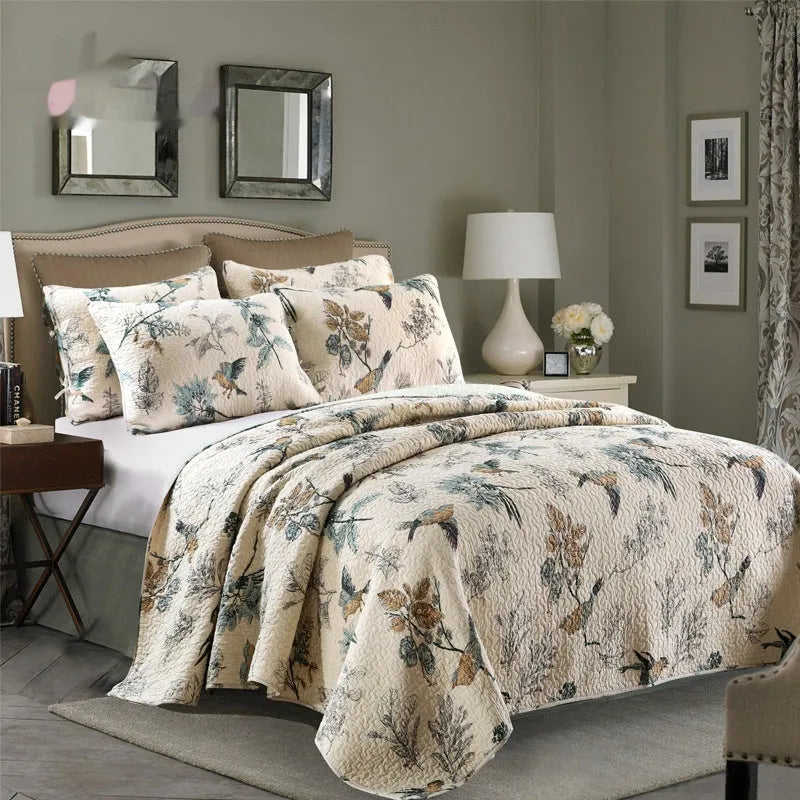 Quilted pure cotton bed cover and pillowcase set with printed pattern on a bed.