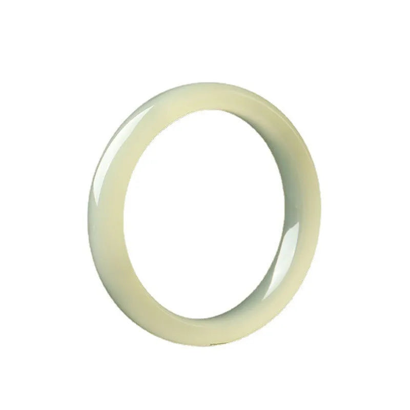 Polished ice-like silk jade round bar bracelet showing its geometric shape and smooth surface