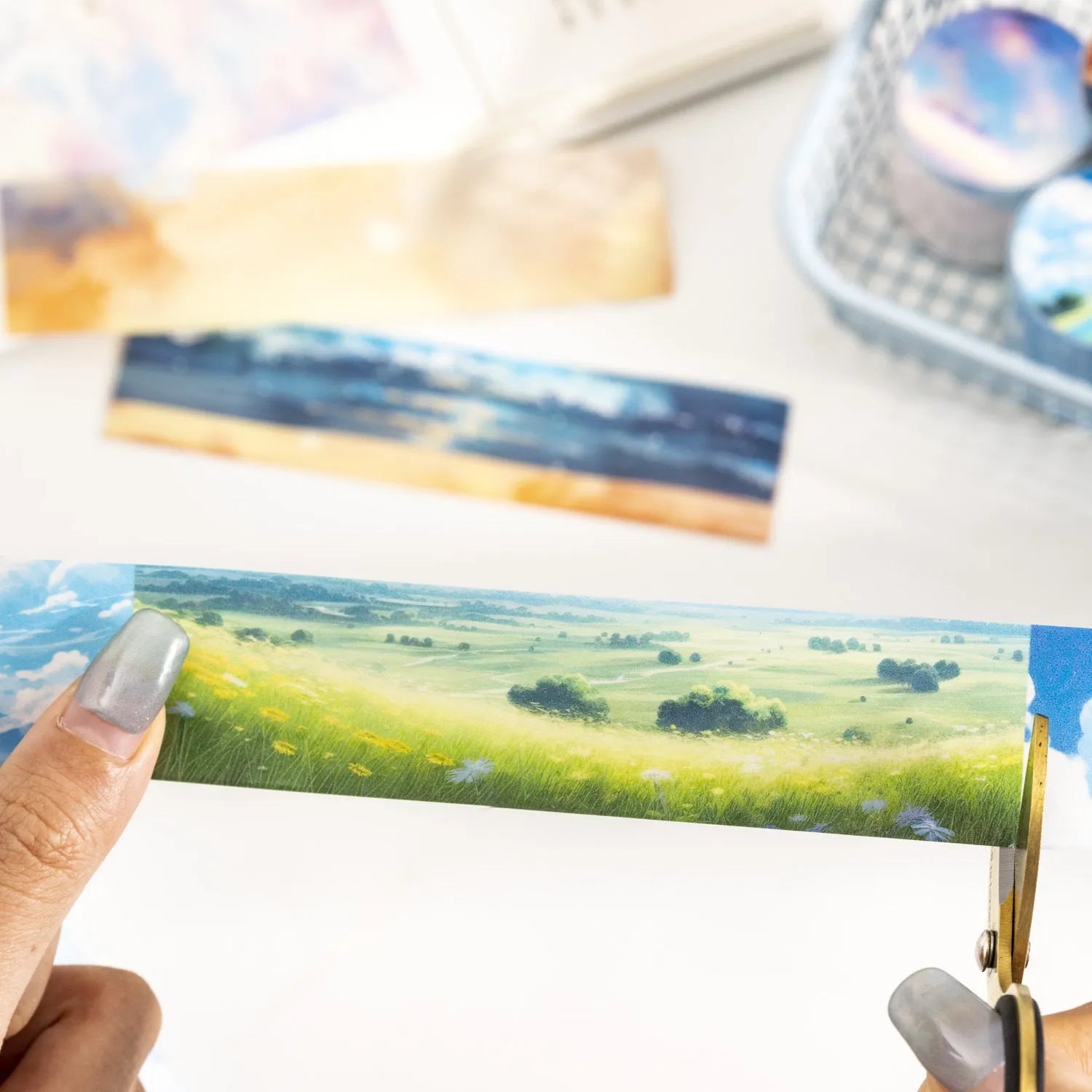 Japanese paper washi tape roll with sky theme designs including clouds, sun, moon, and nebula patterns