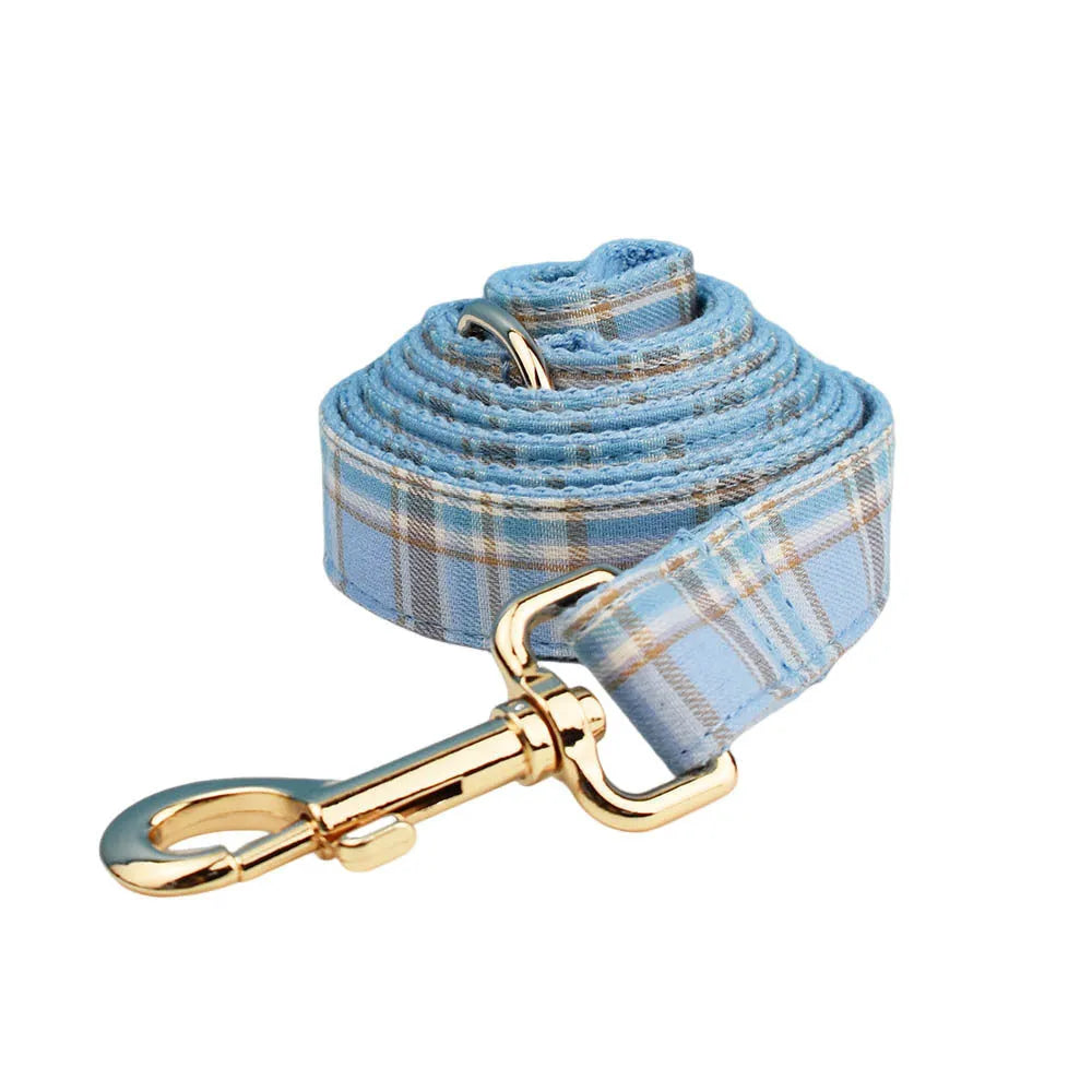 Sky blue grid patterned dog collar, leash, vest, and bow set from the forest series for pets.