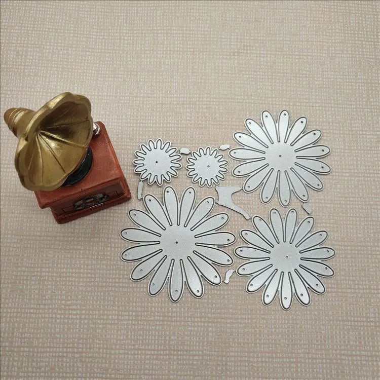 Silver high carbon steel cutting mold with etched flower decoration measuring 12.5x13 cm