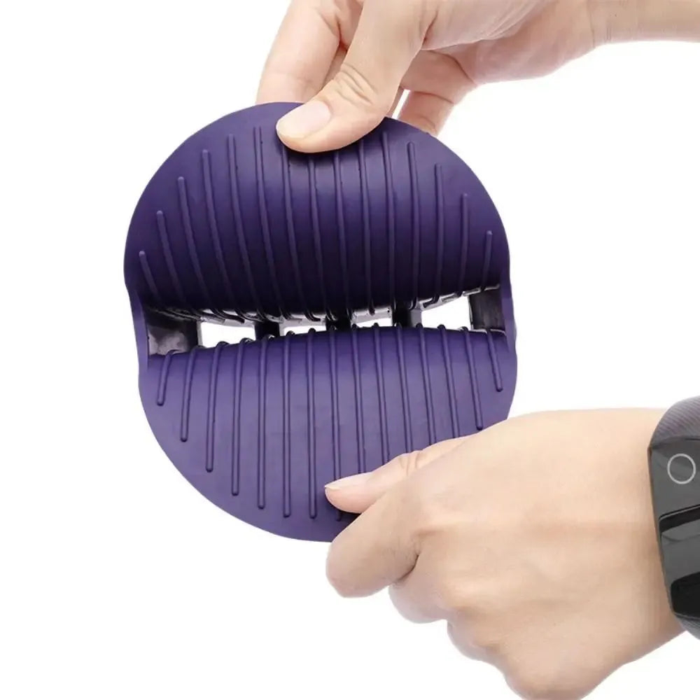 Purple pet grooming brush with soft silicone bristles and ergonomic TPR handle