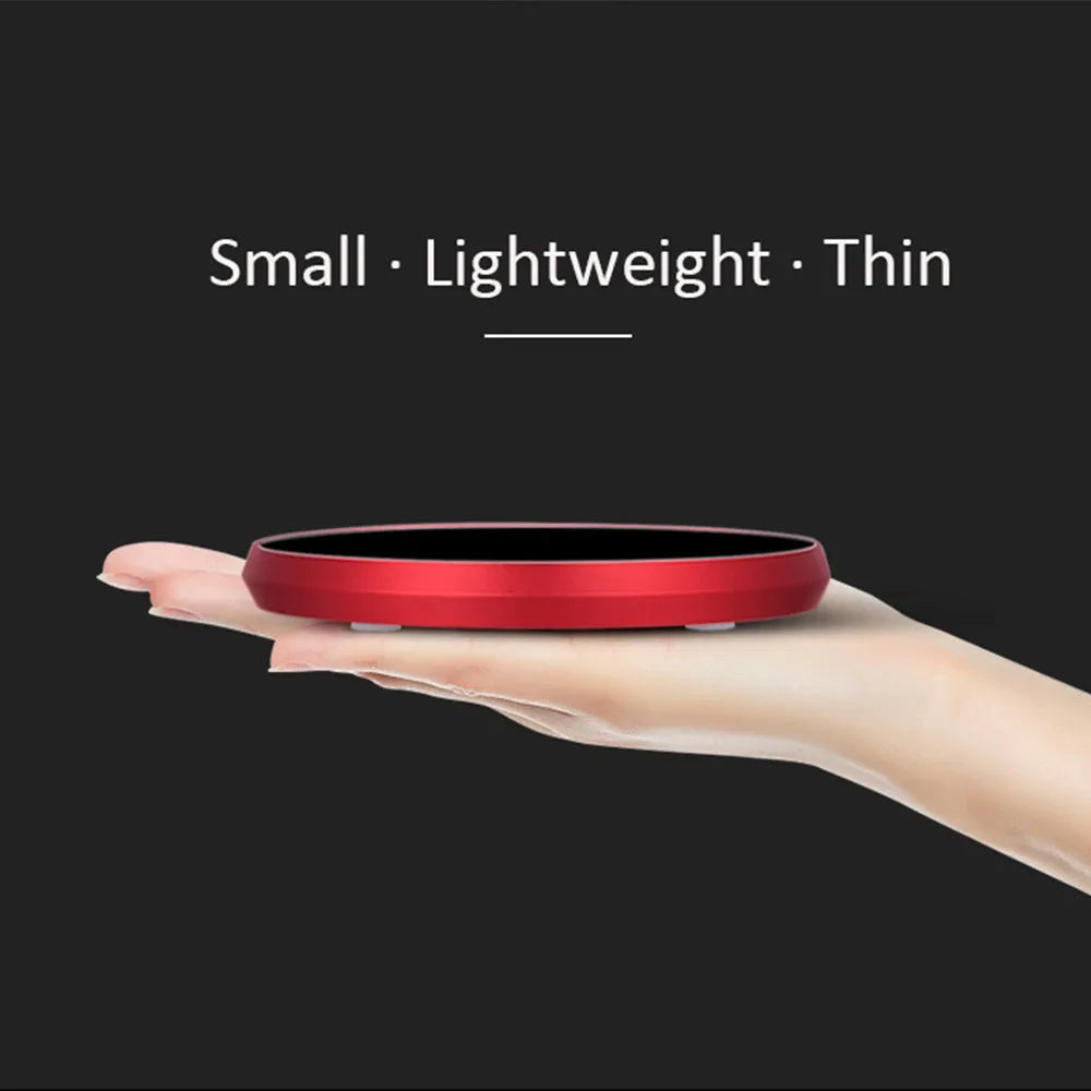 Black USB heating coaster with temperature adjustment buttons for warming coffee and tea mugs