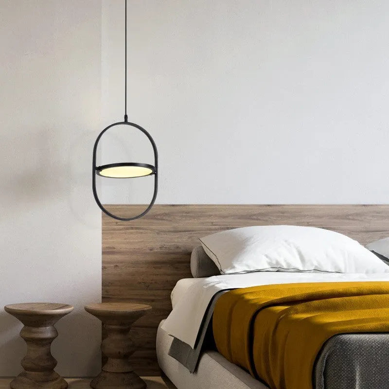 Nordic reversible magic eye bedside lamp with black vertical strip pattern on a bedside table