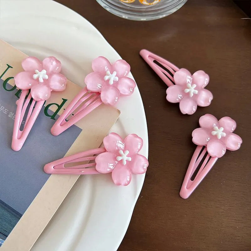 Handmade acrylic cherry blossom hair clip in pink floral design for women