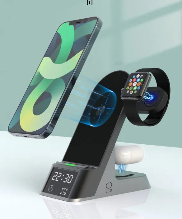 Black multifunctional wireless charging alarm clock with digital display and phone on charging pad.
