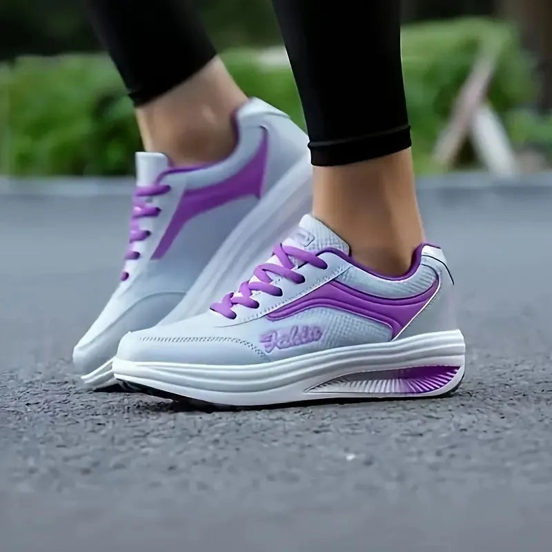 Women's single travel sports shoe in a choice of colours with a mid heel.