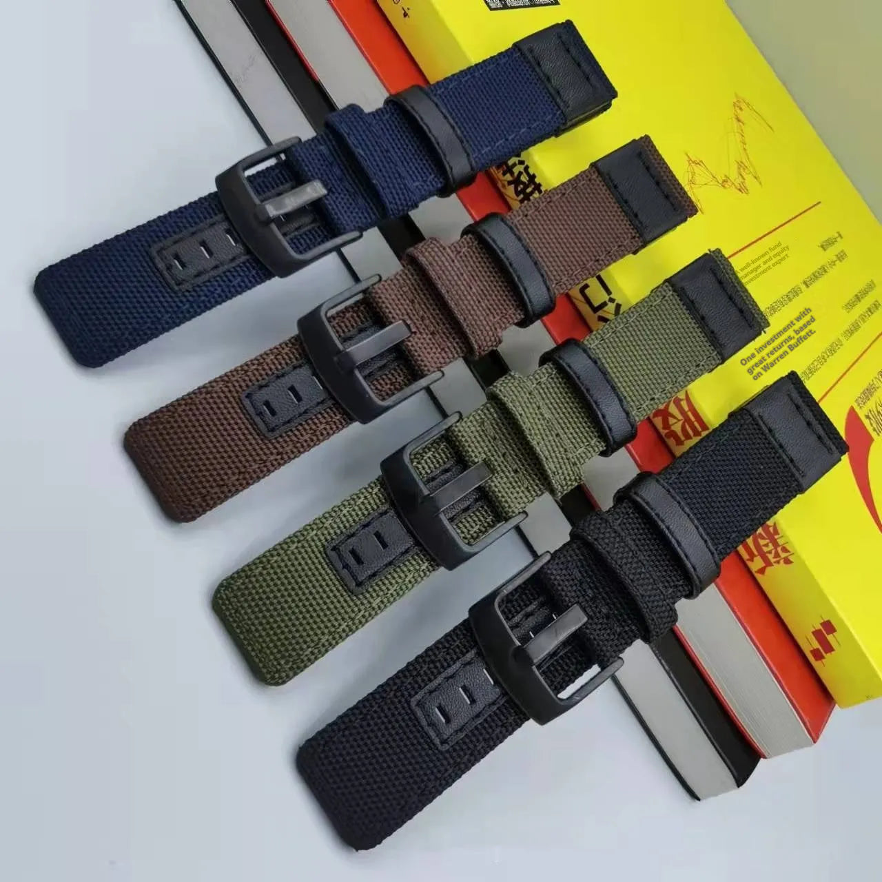 Oxford cloth canvas watch strap shown in multiple colour options including army green, black, and camouflage.