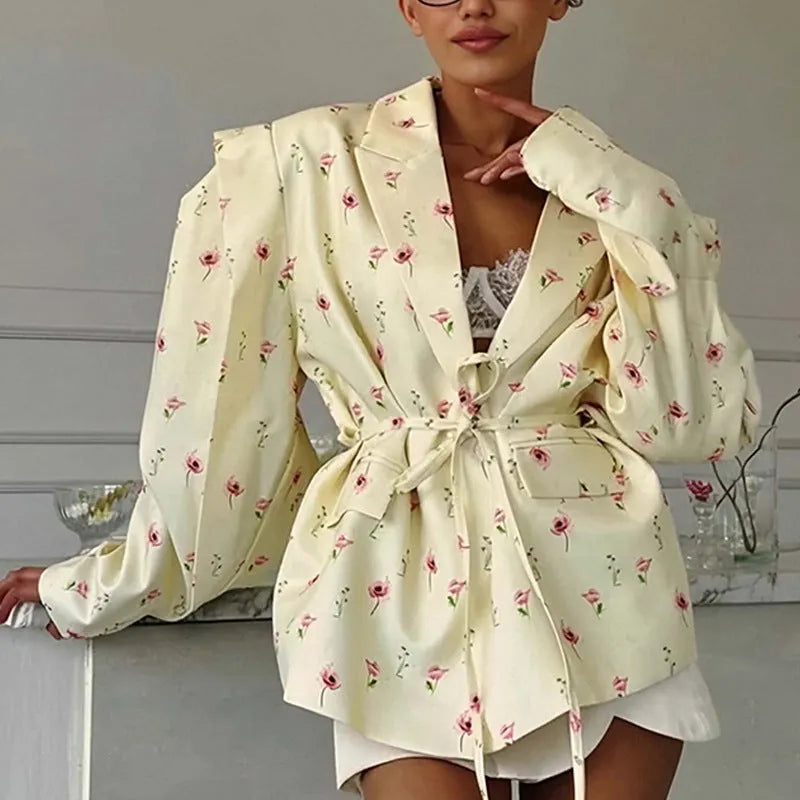 Women's collar lace-up waist-tight suit jacket in polyester, showing front tie detail on a model.