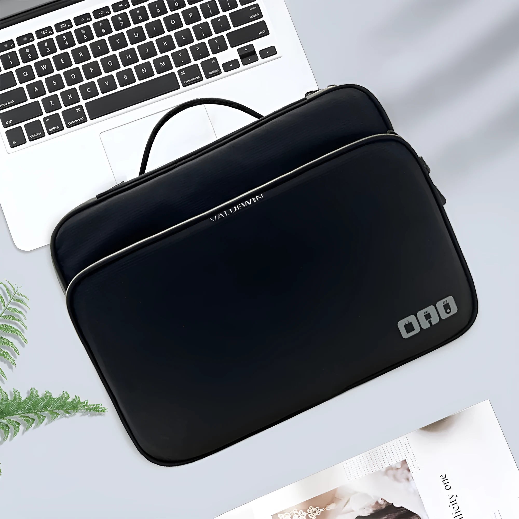 Black three-layer travel storage bag with waterproof polyester construction and sewing line detailing