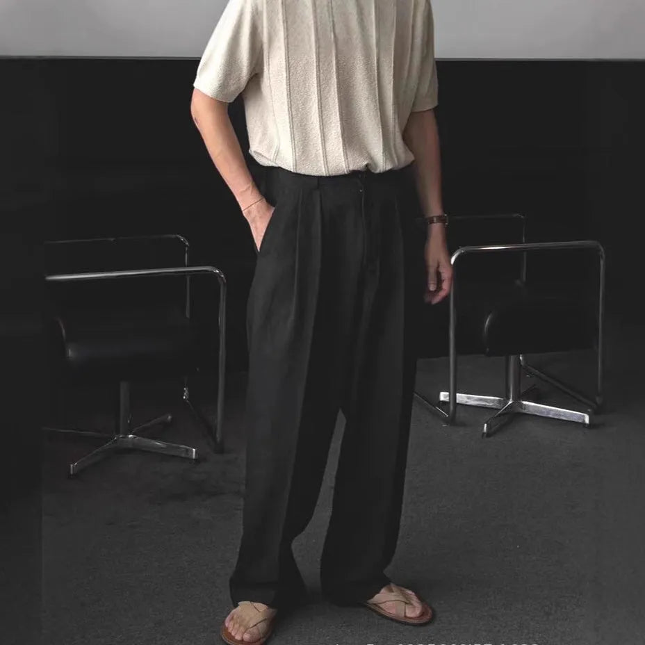 Men's apricot coloured wide-leg cotton linen suit trousers with a loose fit and pencil pants leg opening.
