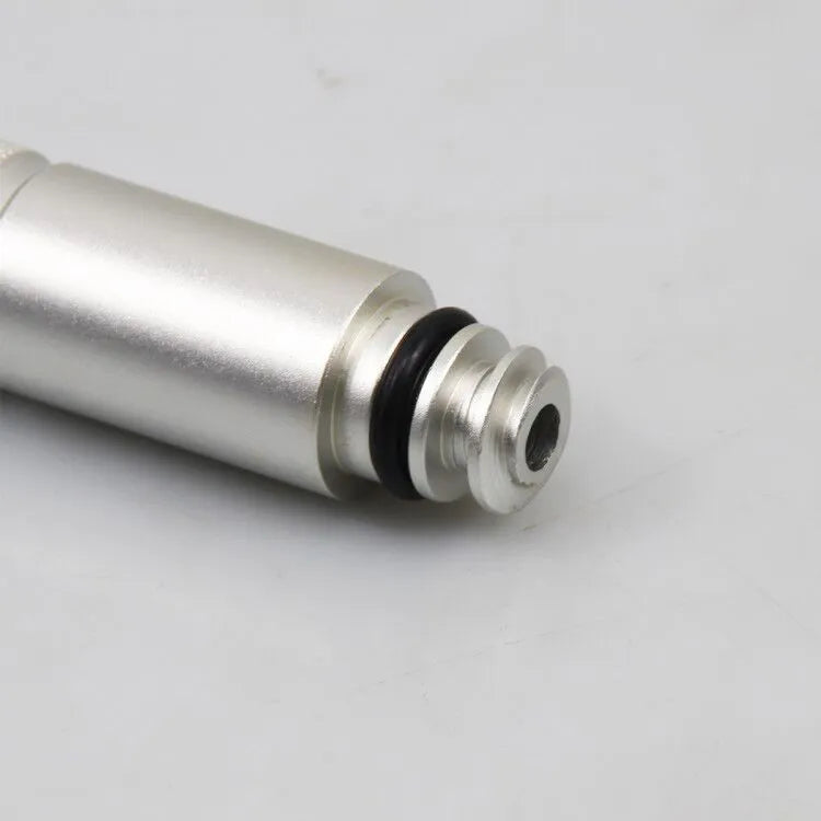 Silver metal VAS6262-9 transmission oil refueling adapter tool on a workshop bench.