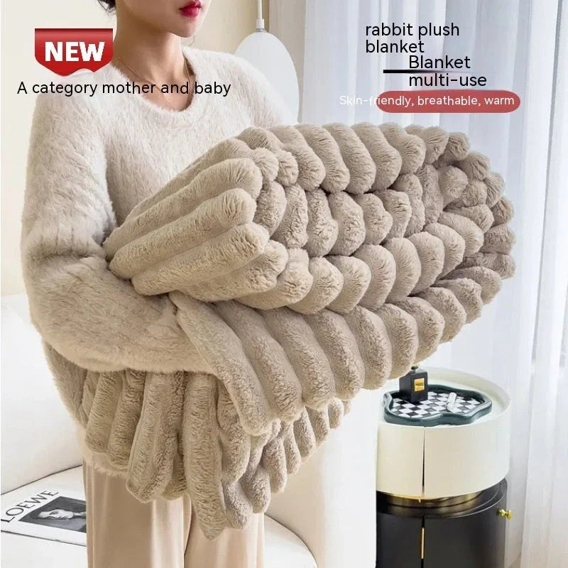 Soft, plush rabbit fur throw blanket in a variety of colors and sizes for cozy comfort at home or on the go.