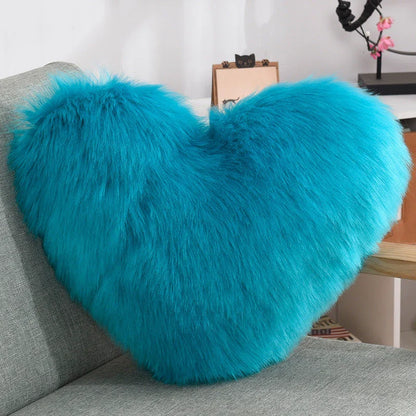 Plush heart-shaped throw pillows in various colors and styles for cozy sofa decor