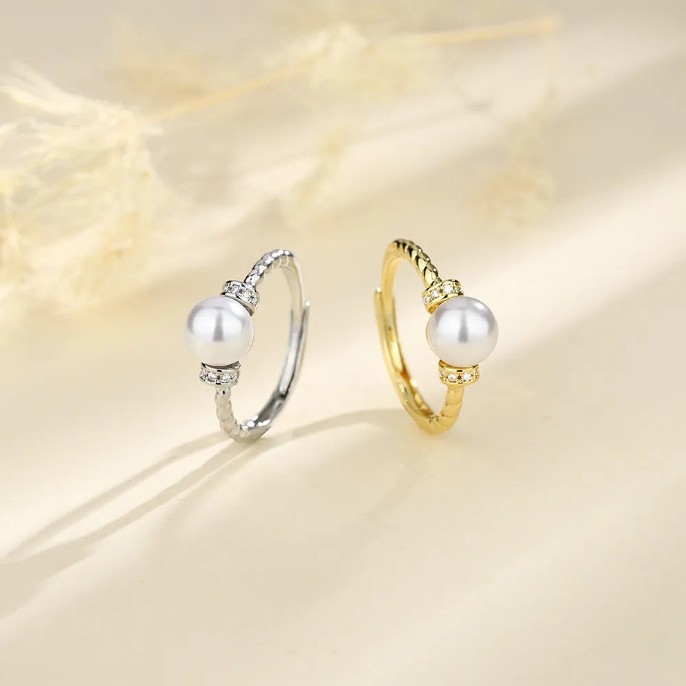 Adjustable antique twist pearl ring in copper with geometric shape and gold silver finish options.