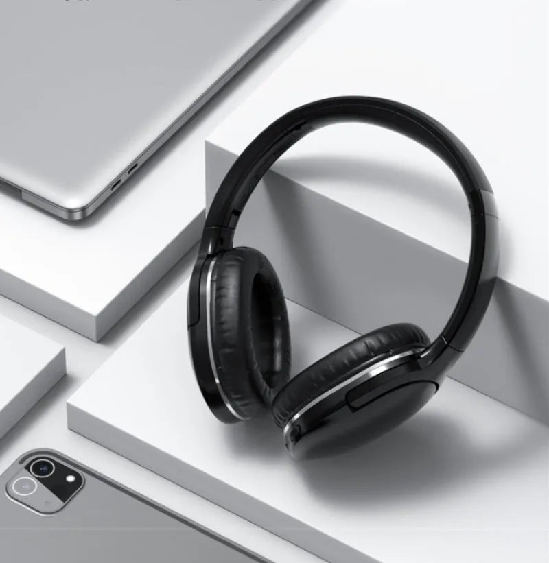 Black and white wireless Bluetooth gaming headset with sports design showing ear cushions and adjustable headband