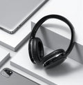 Black and white wireless Bluetooth gaming headset with sports design showing ear cushions and adjustable headband