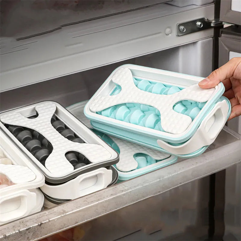 Silicone ice ball mould bottle in light grey, showing integrated ice tray and bottle with lid.