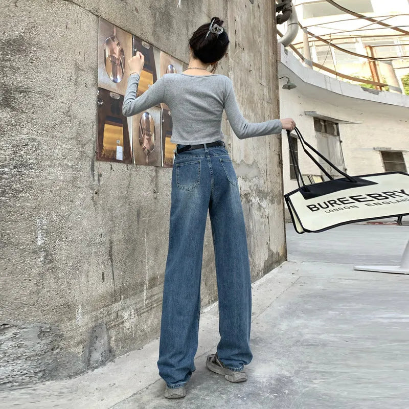 Women's retro blue high waist straight leg jeans laid flat, showing the five-pocket design and button fly.