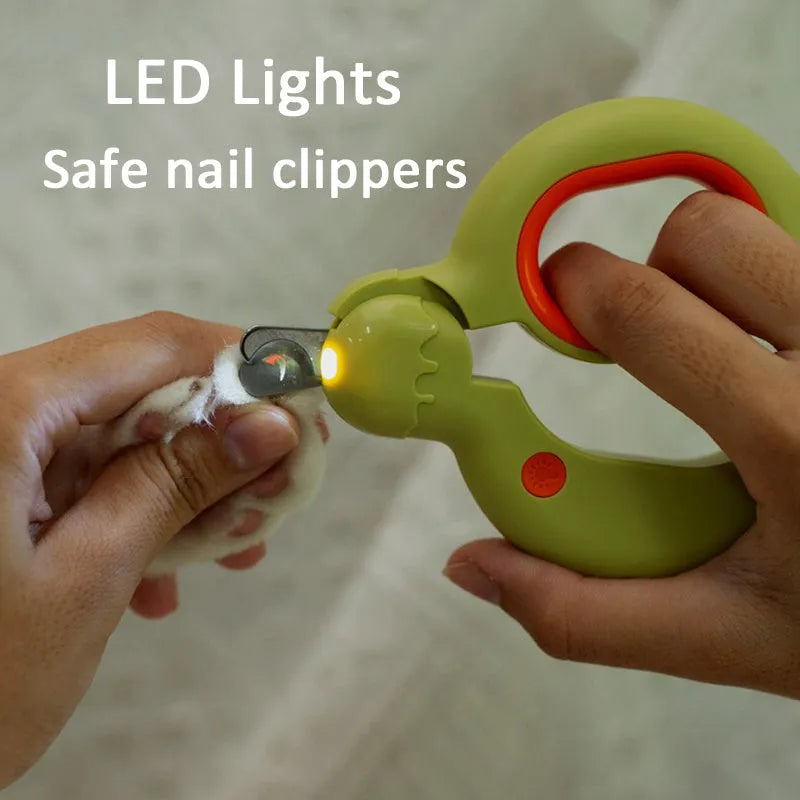 Blue pet nail clippers with LED light on, showing stainless steel blade and non-slip plastic handle.