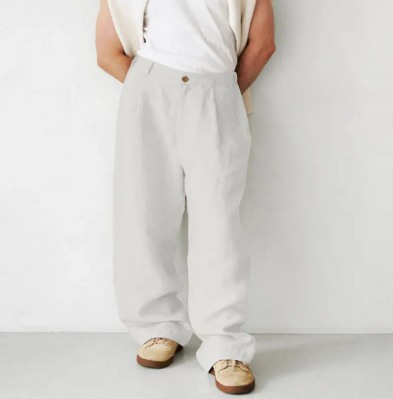 Men's loose high-waist linen jogger pants in grey, showing straight-leg casual style.