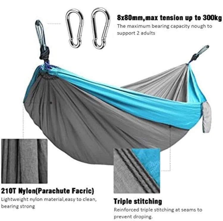 Blue nylon parachute cloth outdoor camping hammock hung between trees