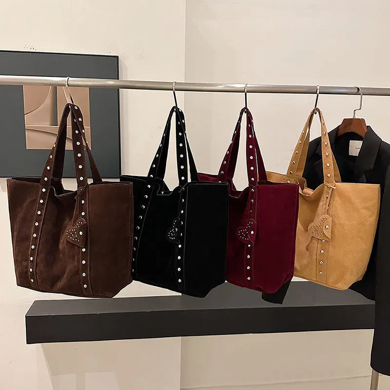 Black PU leather tote bag with double shoulder straps, showing interior sandwich pocket organiser.