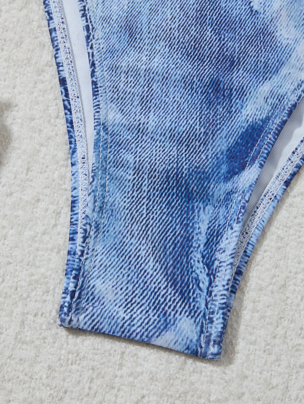 Denim blue printed bikini set with criss-cross straps on the top.