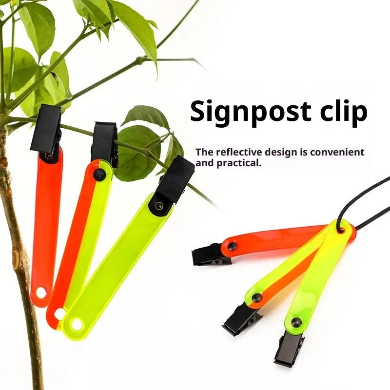 Yellow PVC road sign clip for archery target ribbon marking, size 10.3 cm, on a range background