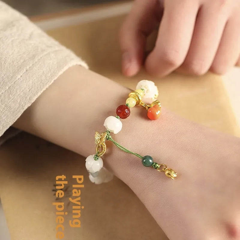 White jade bodhi bracelet with hand-woven lotus and pumpkin beads on open rope