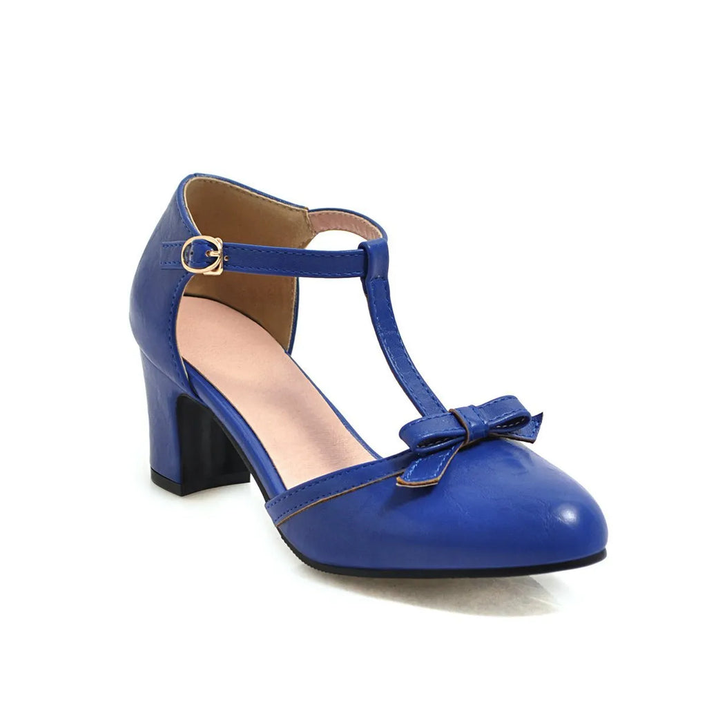 Women's apricot coloured chunky heel sandals with a bow detail and buckle strap on a 6.5cm heel.