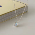 Geometric silver pendant on an adjustable 925 silver curb chain necklace.