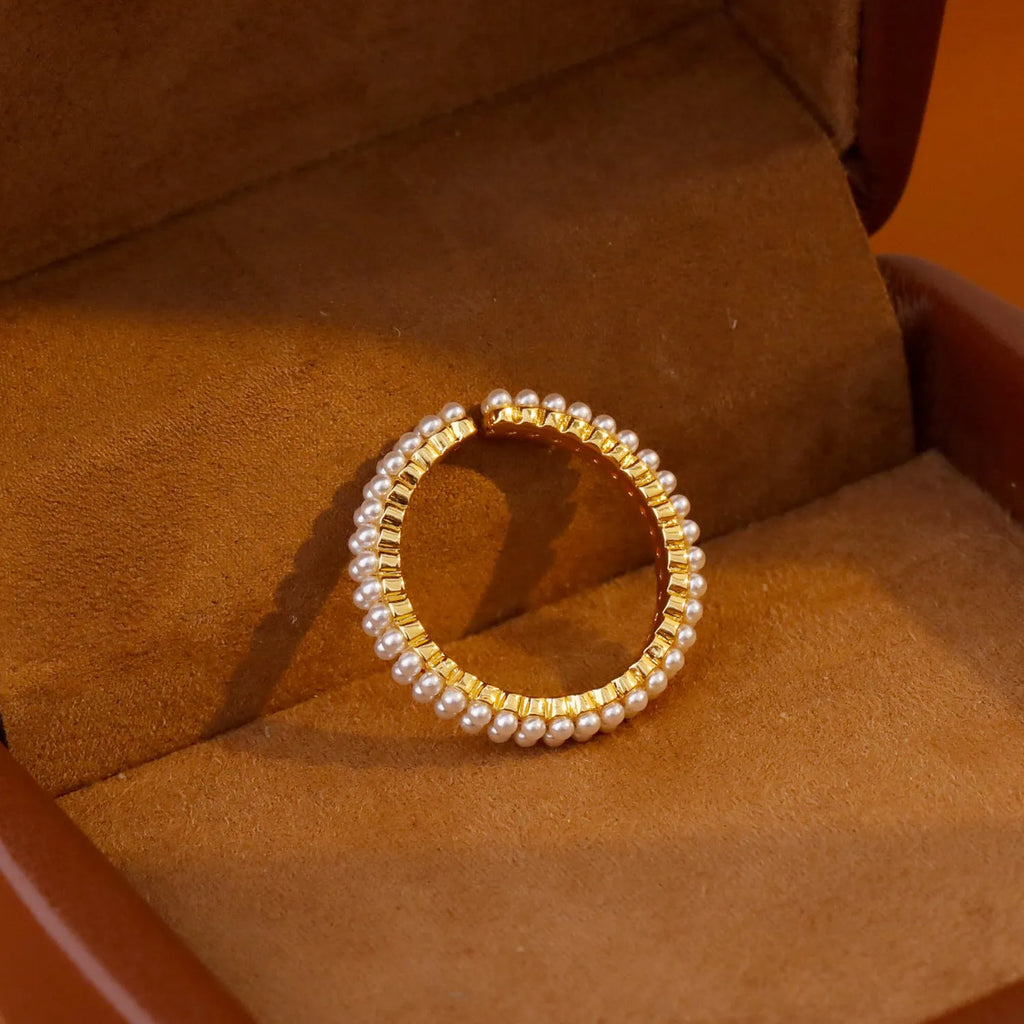 Gold geometric women's ring with open mouth design and round pearl element
