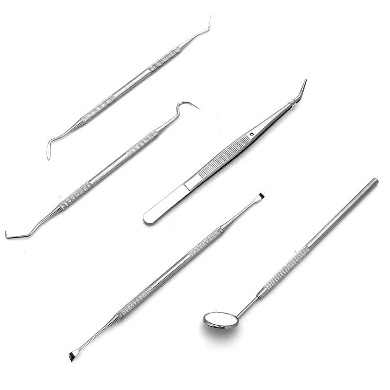 Stainless steel dental tools set with oral mirror and probes on grey background