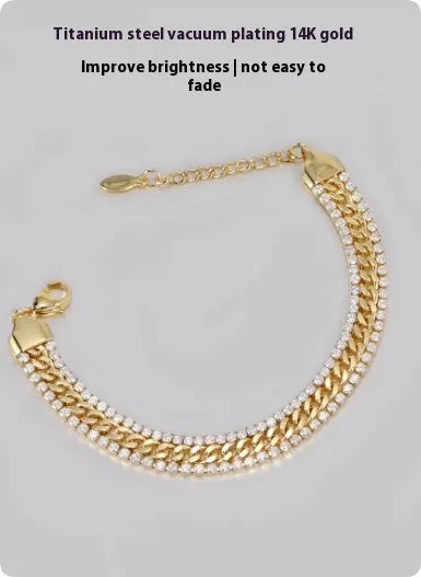 Gold tennis bracelet with electroplated finish and artificial gemstone inlay on titanium steel