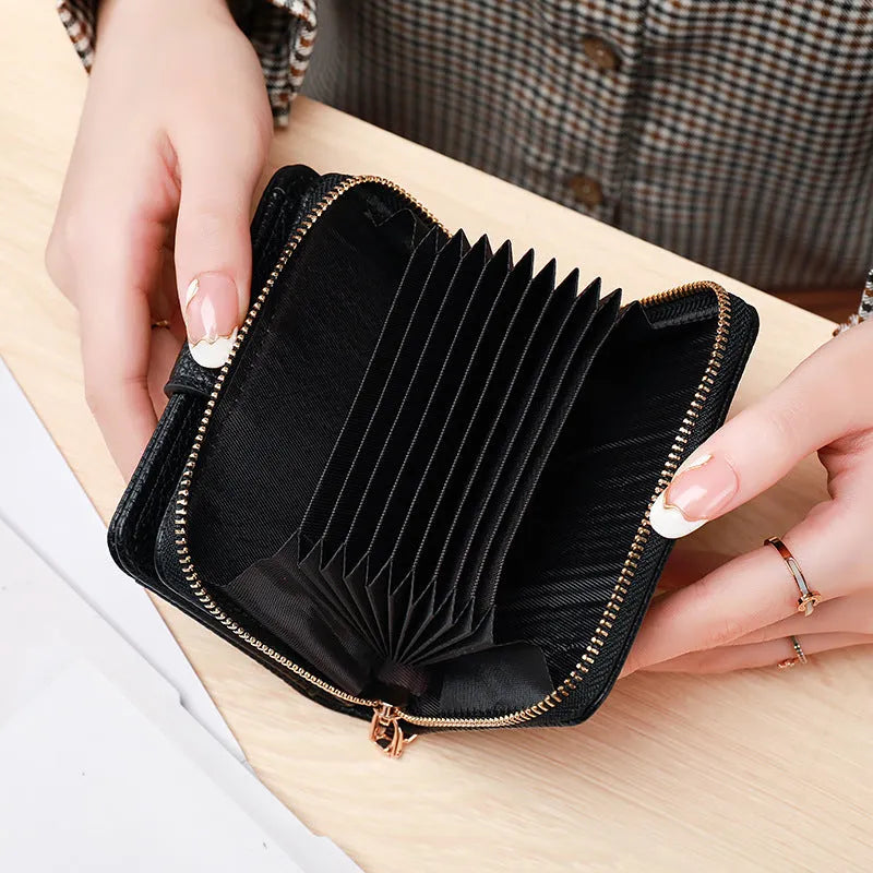 Ladies short wallet with lychee pattern in two-fold PU leather construction