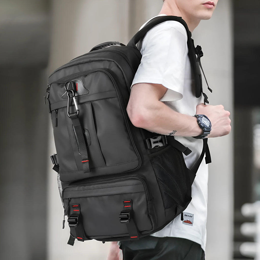 Oxford cloth large capacity travel backpack in black with USB charging port and multiple zippered pockets