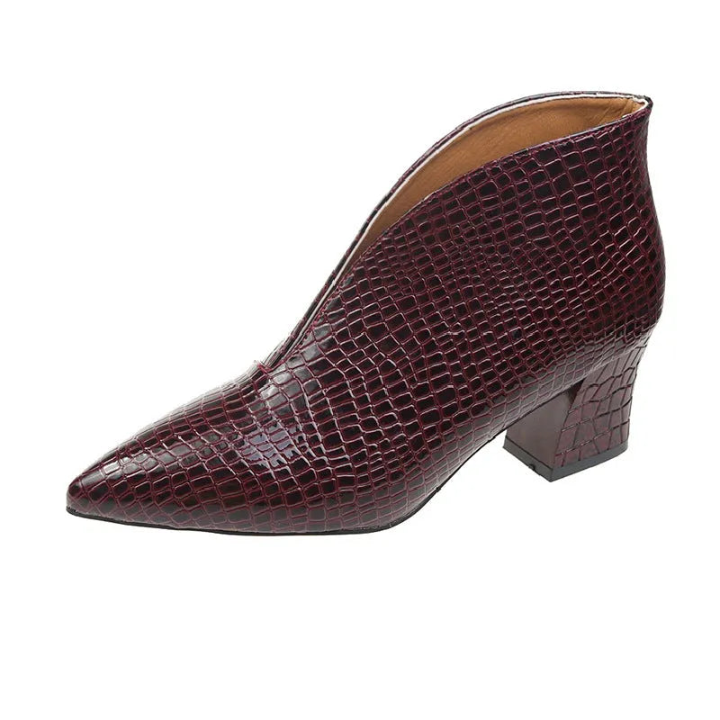 Women's black V-cut pointed toe ankle boots with embossed detail and a chunky block heel.
