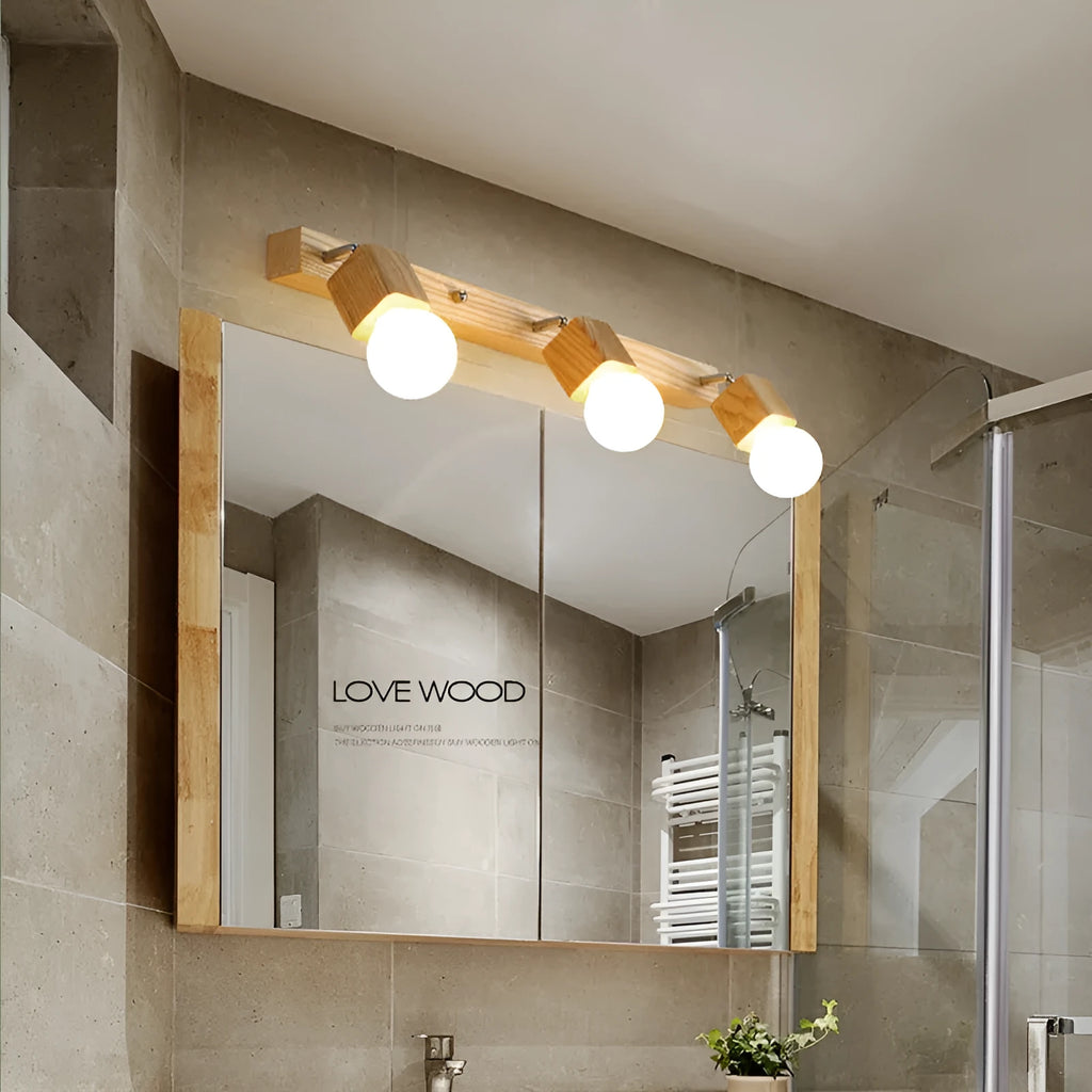 A narrow 24cm wide mirror-finish LED wall lamp with a single light head.