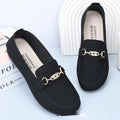 Gommino women's black casual slip-on shoes with round toe and flat rubber sole on a white background.