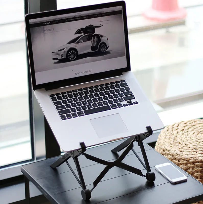 Black foldable portable laptop stand with enhanced nylon construction shown with travel case