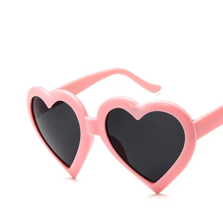 Children's heart-shaped sunglasses with bright red resin lenses and full rim frame